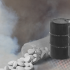 Greyscale graphic showing two oil barrels next to a spilled pill bottle.